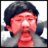 a man with a red face and a mustache