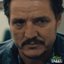 a close up of a man 's face with the words freakin tales written on the bottom