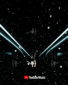 two girls dancing in front of a youtube music sign