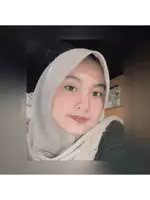 a woman wearing a white hijab and a black shirt