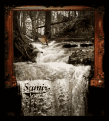 a framed picture of a waterfall with the name samir on the bottom