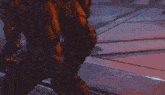 a person is holding a gun that is shooting a red light