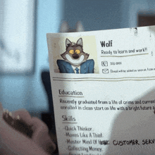 a person is holding a resume for wolf with a picture of a wolf on it