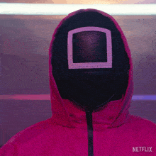 a person wearing a netflix jacket and a mask