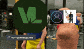 a picture of a man with a green circle with the letter m on it