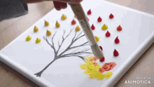 a person is painting a tree on a canvas made in animatica
