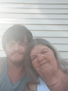 a man and a woman pose for a picture together