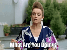 a woman says what are you doing in a floral dress
