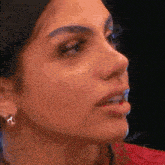 a close up of a woman 's face with her mouth open .