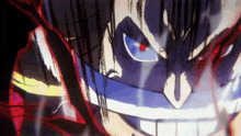 a close up of a man 's face with red eyes