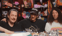 a man wearing a gracias hat is surrounded by other men