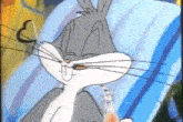 bugs bunny from looney tunes is sitting in a chair