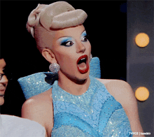a woman in a blue dress with a surprised look on her face and the words t4yce tumblr underneath