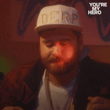 a man is wearing a hat that says derd on it