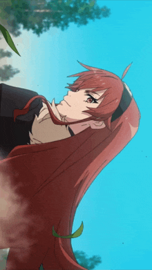 a girl with long red hair is looking up into the sky
