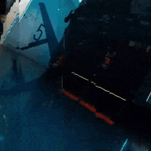 a dark room with a blue light shining through it