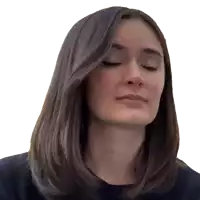 a woman with her eyes closed is wearing a black sweater