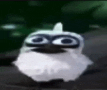 a cartoon owl with big eyes and a beard is standing on a rock .
