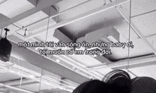 a black and white photo of a ceiling with a quote in foreign language