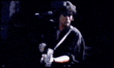 a person is singing into a microphone in a blurry photo