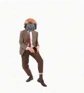 a man in a suit and tie is wearing a helmet and glasses .