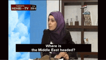 a woman in a purple hijab is asking where is the middle east headed on a tv show