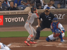 a baseball player with the number 51 on his jersey swings at a pitch