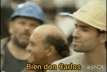 a man wearing a hard hat says bien don carlos in a video