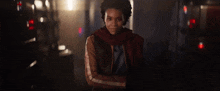 a person is holding a gun to a woman in a dark room