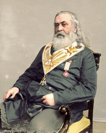 a man in a masonic costume has the number 35 on his chest