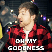 a man wearing a plaid shirt says oh my goodness