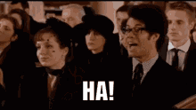 a group of people are sitting in a church and a man is pointing at a woman with the words wrong .
