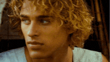 a close up of a man 's face with blonde hair
