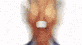 a close up of a person 's face with a very angry look on their face .