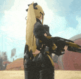 a girl with a ponytail is holding a gun with the word sniper on the back of it