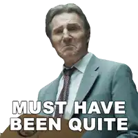 a man in a suit and tie has the words must have been quite on his face
