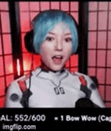 a woman with blue hair and headphones is talking into a microphone in a room .