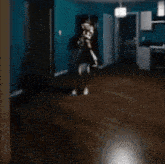 a person is sitting on the floor in a dark room .