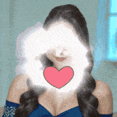 a woman with a pink heart in front of her eyes