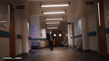 a hospital hallway with a sign for ambulance patient