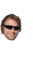 a man wearing sunglasses and a beard smiles on a white background