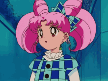 a girl with pink hair is wearing a plaid shirt and earrings
