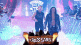 two men are walking through a tunnel with a sign that says " chris sabin "