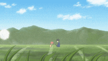 a boy and a girl are standing in a grassy field