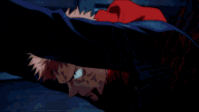 a close up of a person 's face with a red hood