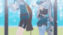 a couple of anime characters are standing next to each other on a field .