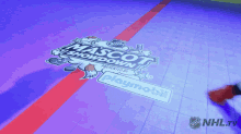 a mascot showdown logo is displayed on the floor