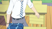 a man in a tie holds a blue bag
