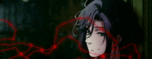a close up of a person 's face with a red string coming out of it .