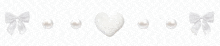 a row of white bows and pearls with a heart in the middle on a white background .